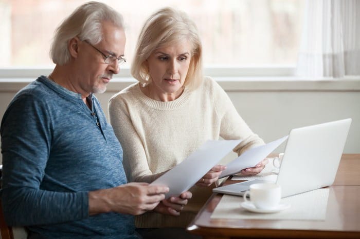 Older couple looking at forms